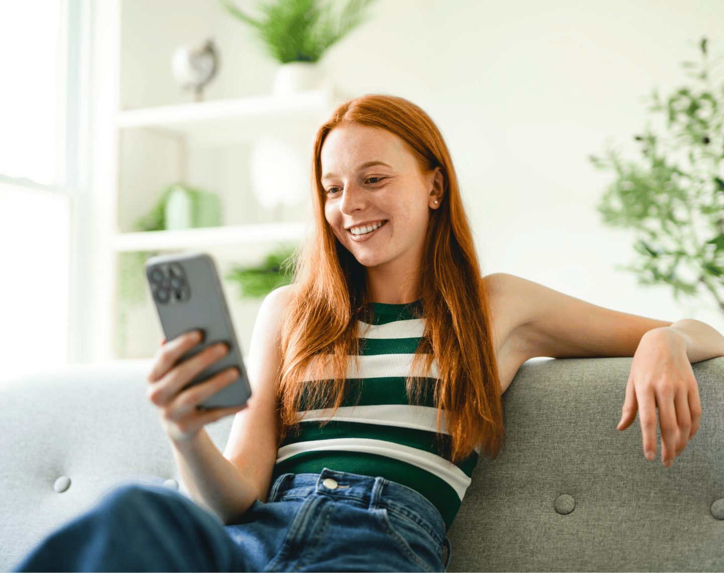 Young Female Consumer on Phone Smiling