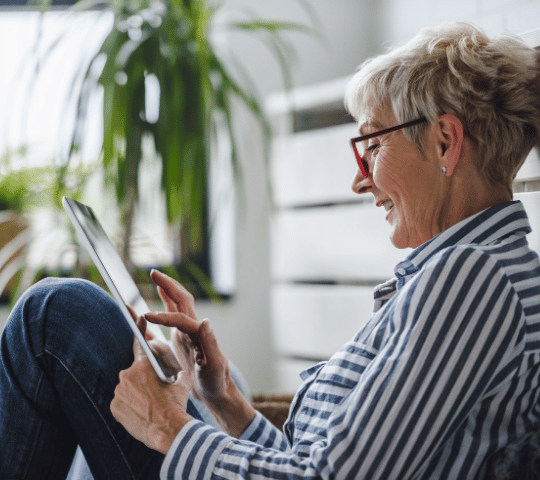 Young Adult Consumer on Phone in Train Station