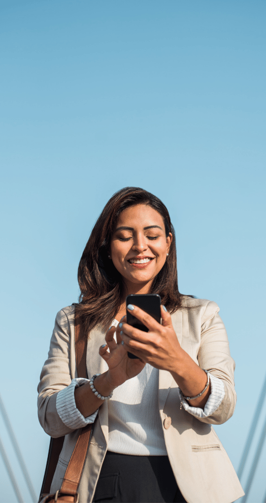 Professional Woman Smiling While on Phone on a Walk