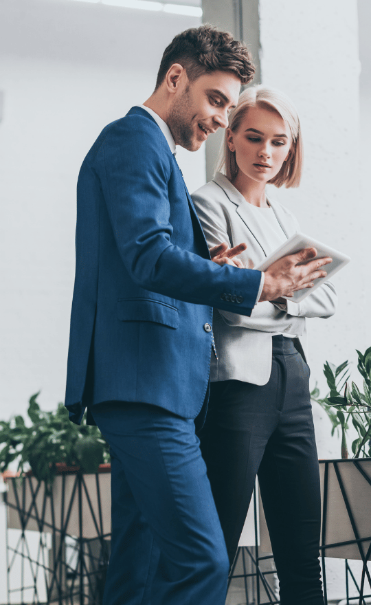 Two Young Business Professionals In a Office